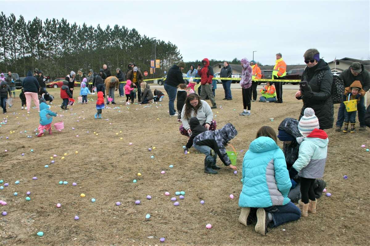 Cold, wind and even a little snow didn't keep the crowds from descending on the Evart High School grounds for the annual Easter Egg Drop. Weather prevented the helicopter from dropping eggs, but that didn't dampen the spirt as kids of all ages scrambled to collect thousands of candy-filled eggs scattered about the ground.
