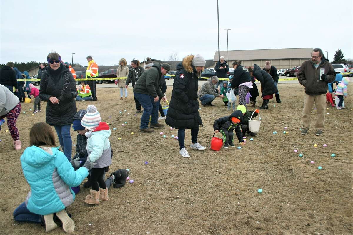 Cold, wind and even a little snow didn't keep the crowds from descending on the Evart High School grounds for the annual Easter Egg Drop. Weather prevented the helicopter from dropping eggs, but that didn't dampen the spirt as kids of all ages scrambled to collect thousands of candy-filled eggs scattered about the ground.