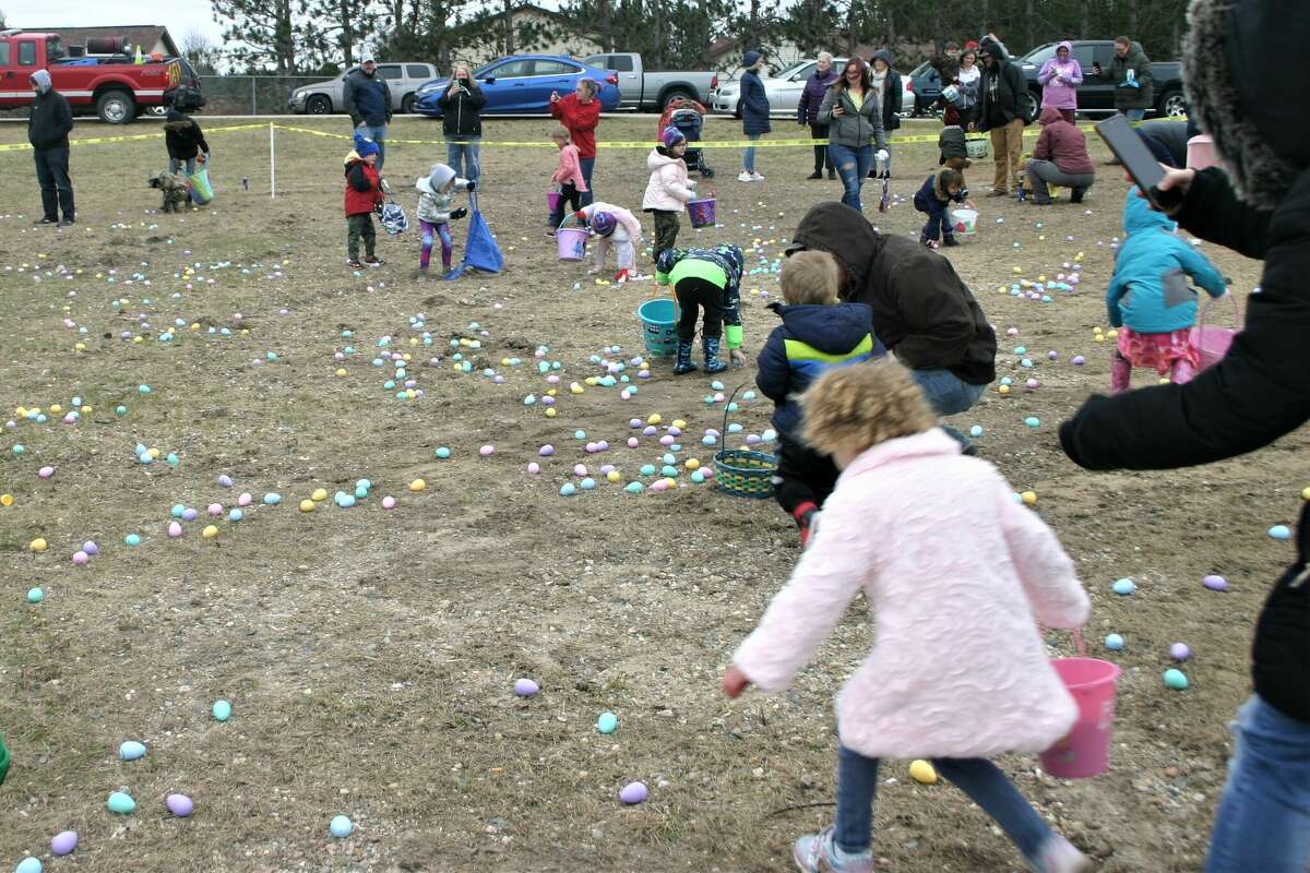 Cold, wind and even a little snow didn't keep the crowds from descending on the Evart High School grounds for the annual Easter Egg Drop. Weather prevented the helicopter from dropping eggs, but that didn't dampen the spirt as kids of all ages scrambled to collect thousands of candy-filled eggs scattered about the ground.