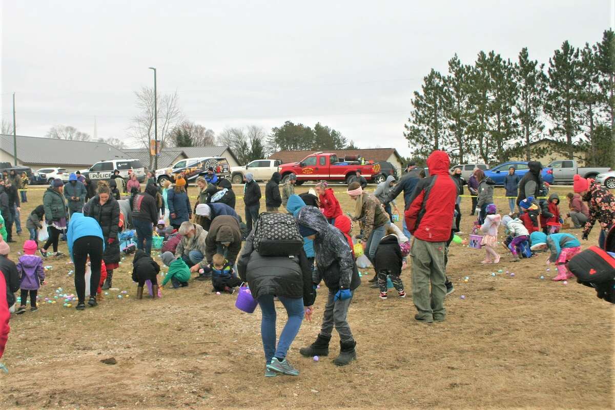 Cold, wind and even a little snow didn't keep the crowds from descending on the Evart High School grounds for the annual Easter Egg Drop. Weather prevented the helicopter from dropping eggs, but that didn't dampen the spirt as kids of all ages scrambled to collect thousands of candy-filled eggs scattered about the ground.