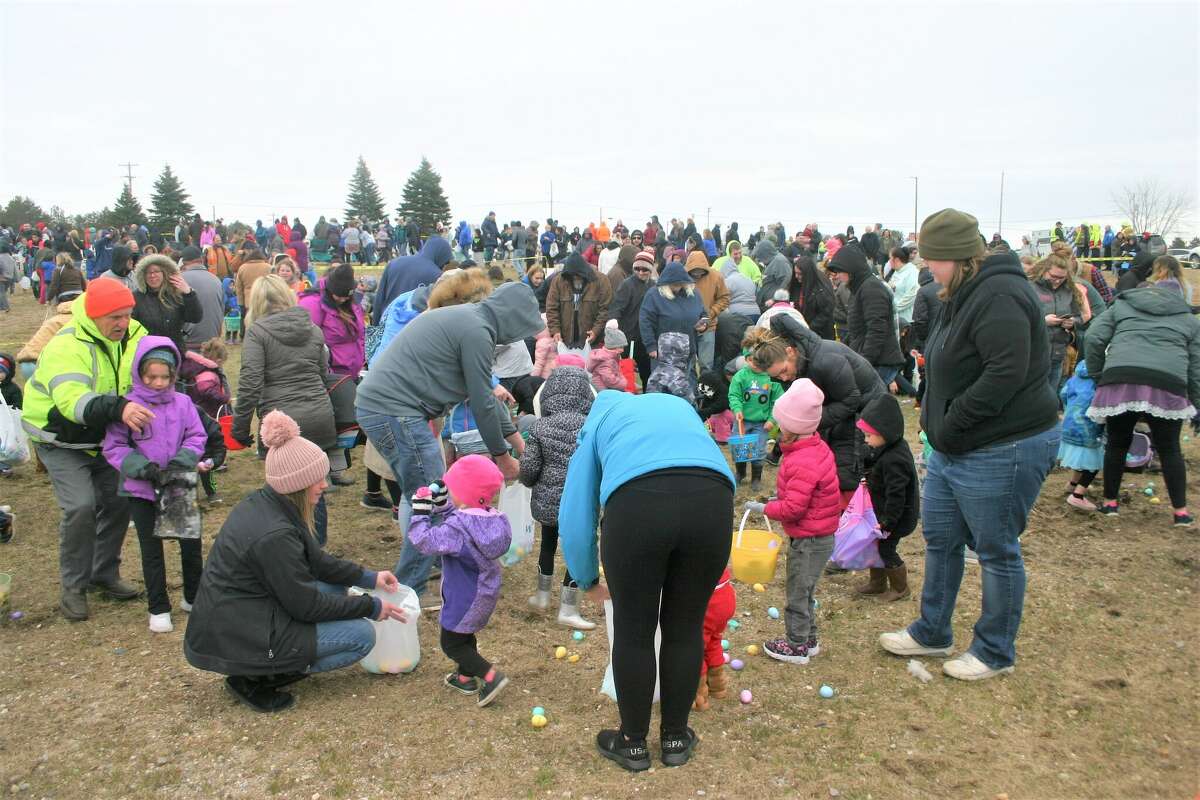Cold, wind and even a little snow didn't keep the crowds from descending on the Evart High School grounds for the annual Easter Egg Drop. Weather prevented the helicopter from dropping eggs, but that didn't dampen the spirt as kids of all ages scrambled to collect thousands of candy-filled eggs scattered about the ground.