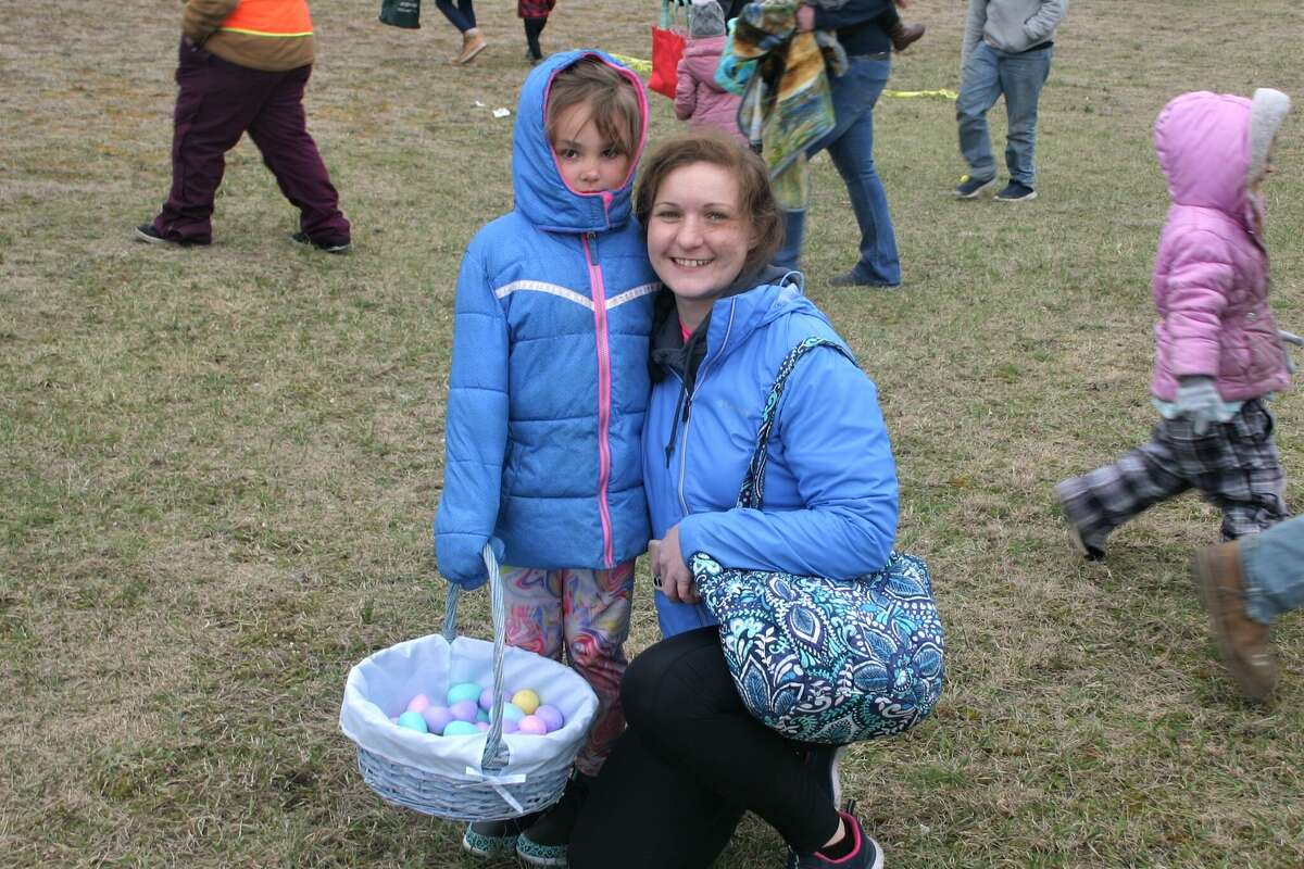Cold, wind and even a little snow didn't keep the crowds from descending on the Evart High School grounds for the annual Easter Egg Drop. Weather prevented the helicopter from dropping eggs, but that didn't dampen the spirt as kids of all ages scrambled to collect thousands of candy-filled eggs scattered about the ground.