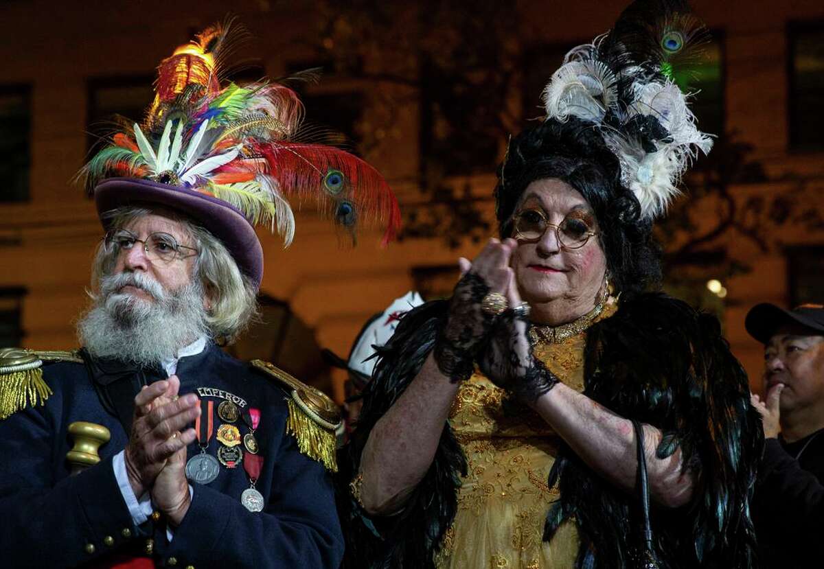 Rick Shelton, dressed as Countess Lola Montez, with Joseph Amster, dressed as Emperor Norton, attend the 116th Annual 1906 San Francisco Great Earthquake and Fire wreath-laying and commemoration at Lotta's Fountain on Market Street in San Francisco, California. On Monday, April 18, 2022.