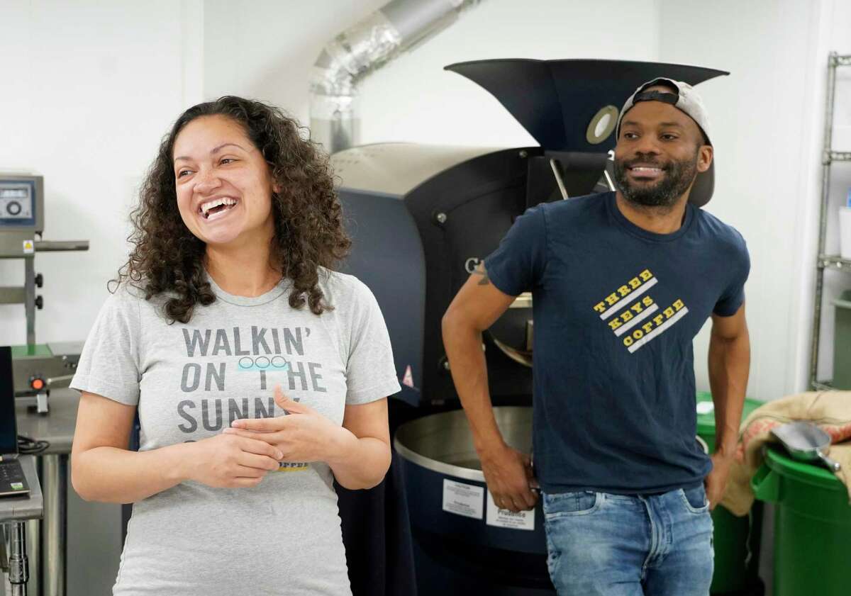 Kenzel Fallen, left, and her husband, Tio Fallen, talk about coffee at Three Keys Coffee, a small coffee roasting company they own.