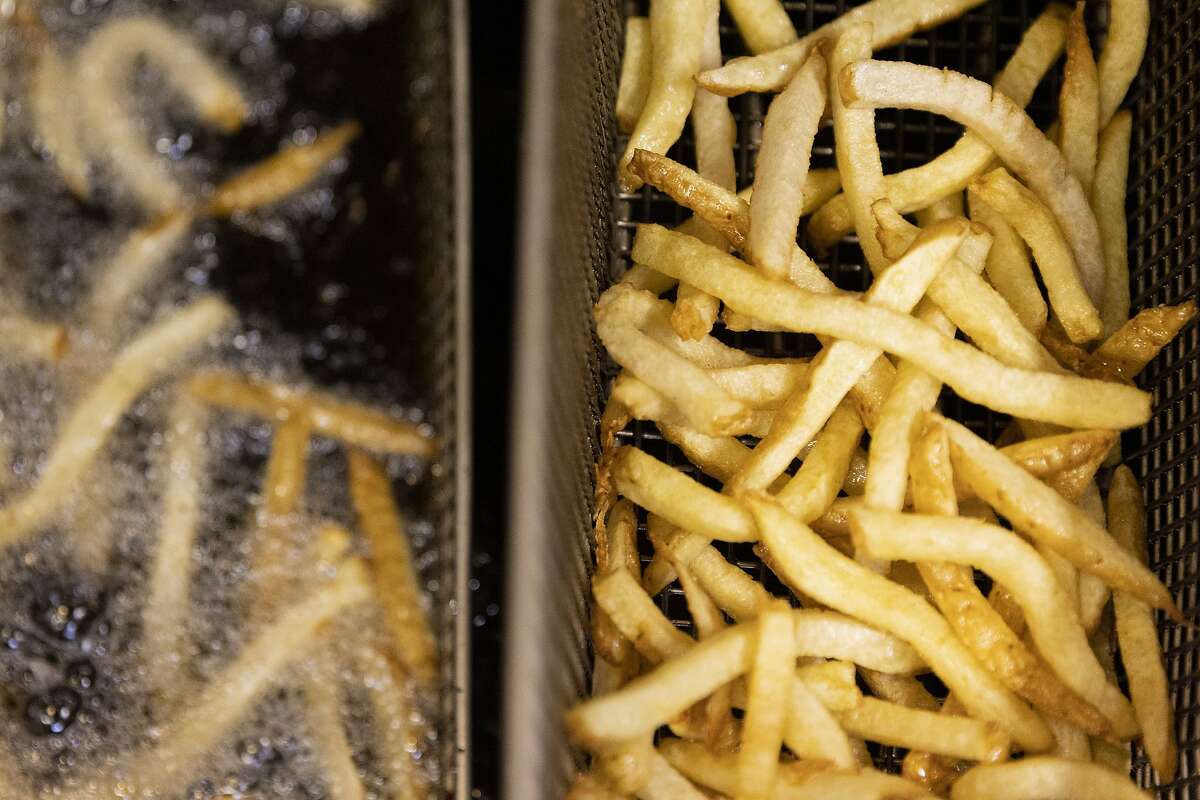 The brine pickled French fries are fried at AL's Place, Thursday, April 14, 2022, in San Francisco, Calif.