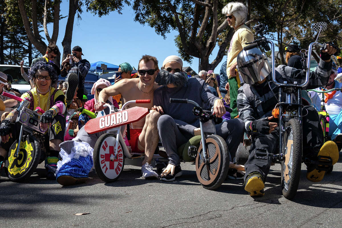 Costumed participants prepare to descend Vermont Street during the annual Bring Your Own Big Wheel event, on Sunday, April 17, in San Francisco. 