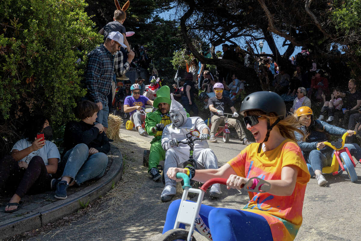 Costumed participants descend Vermont St. in Portrero Hill during the annual Bring Your Own Big Wheel event, on Sunday April 17.