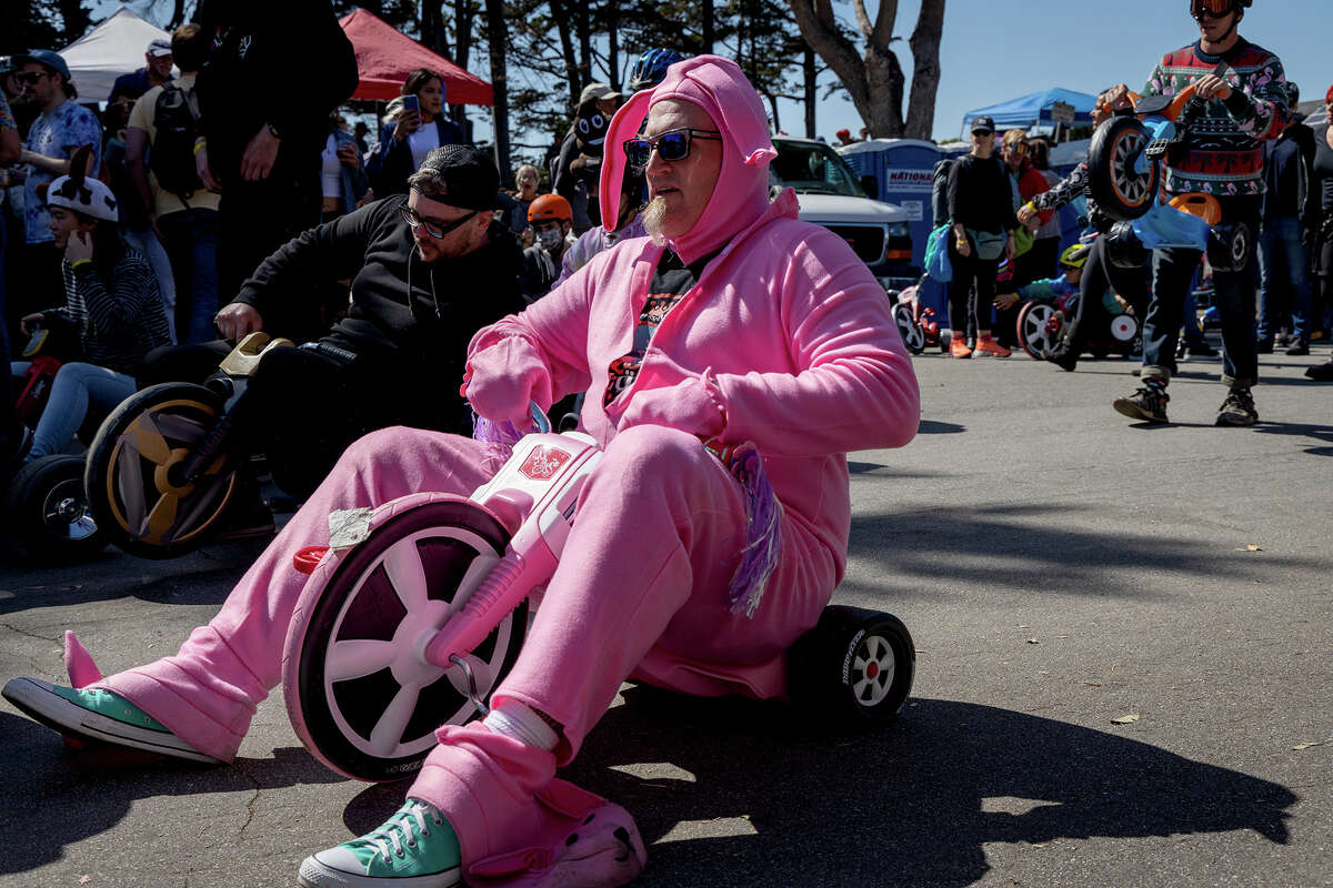 Costumed participants prepare to descend Vermont Street during the annual Bring Your Own Big Wheel event, on Sunday, April 17, in San Francisco. 