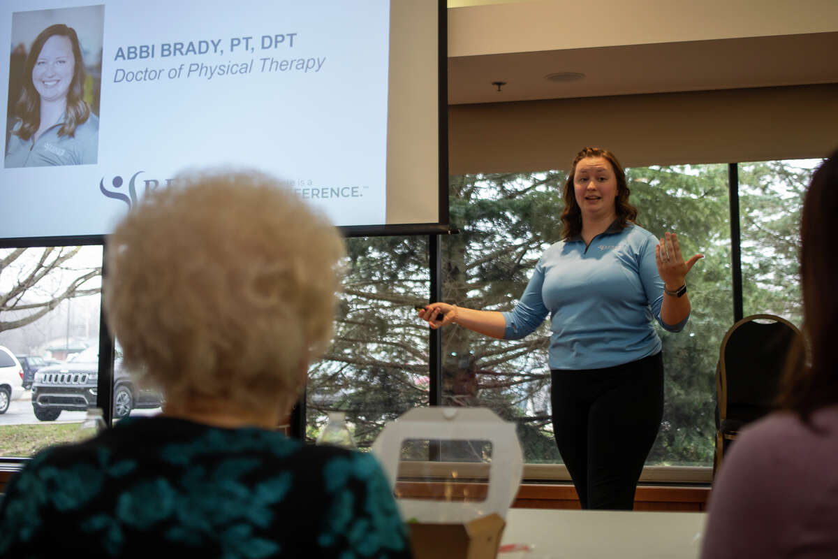 Dr. Abbi Brady, right, speaks with a group of seniors about common shoulder injuries during a "Lunch and Learn" event Monday, April 18, 2022 at the Greater Midland Community Center.