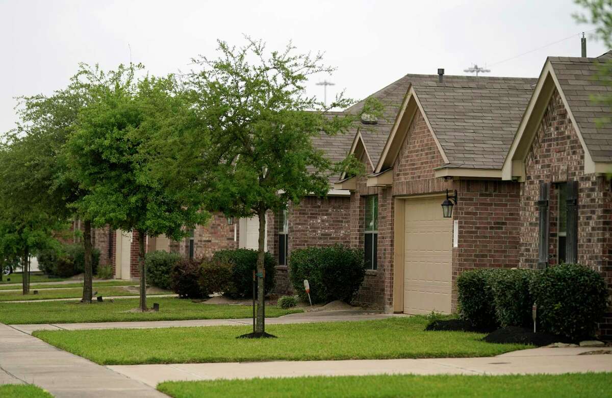 Homes along Kirkland Woods Drive are shown Tuesday, April 12, 2022, in Houston.