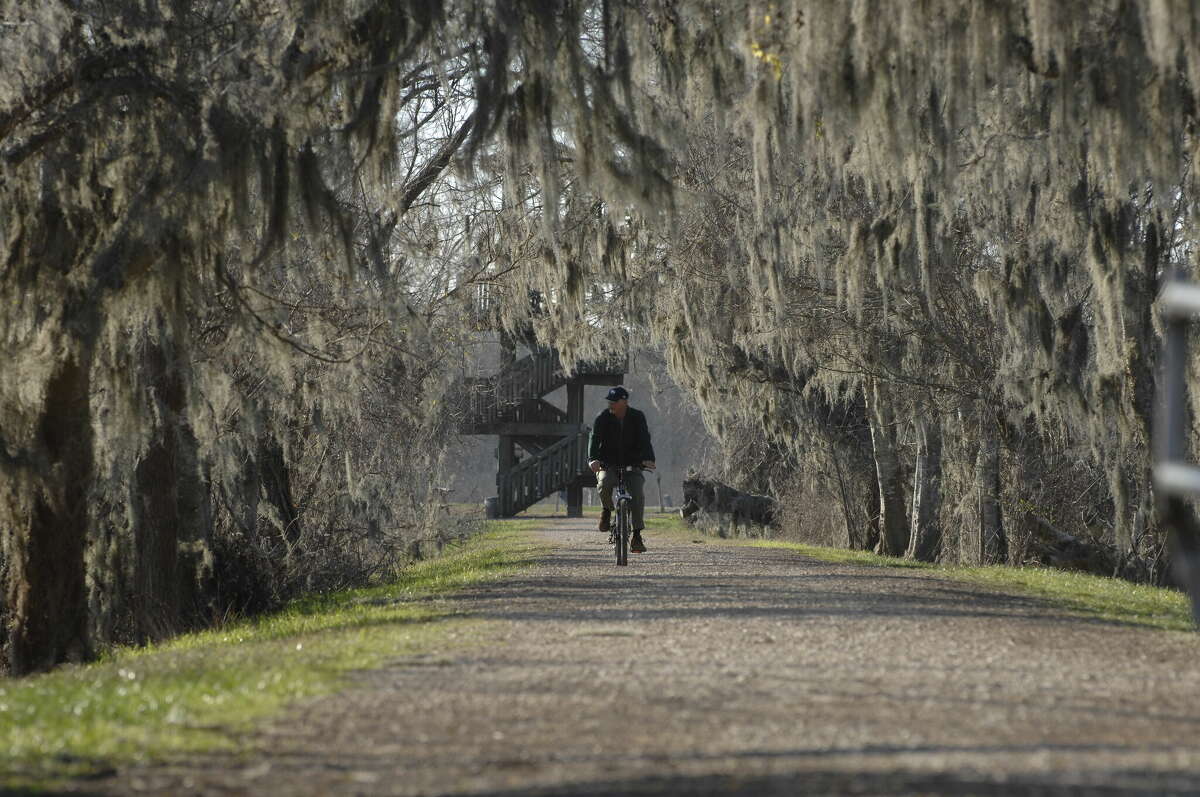 A man riding on the trails of Brazos Bend State Park. 