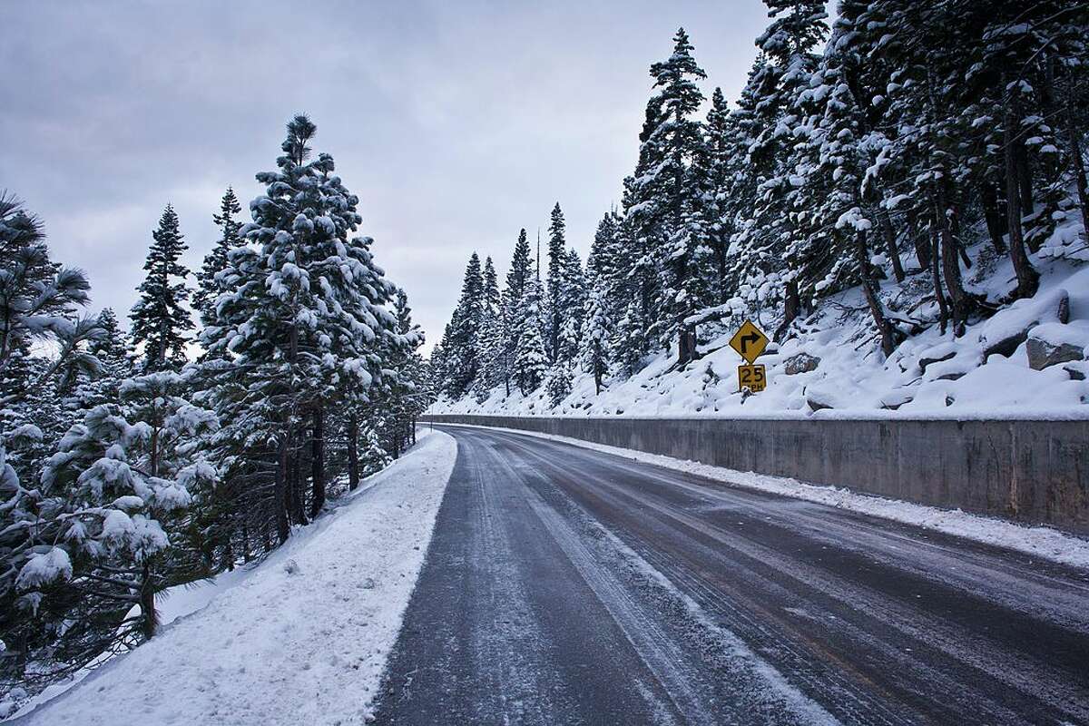 A recent heavy snowfall coats the trees along state Highway 89 on March 8, 2013, in South Lake Tahoe, Calif. 
