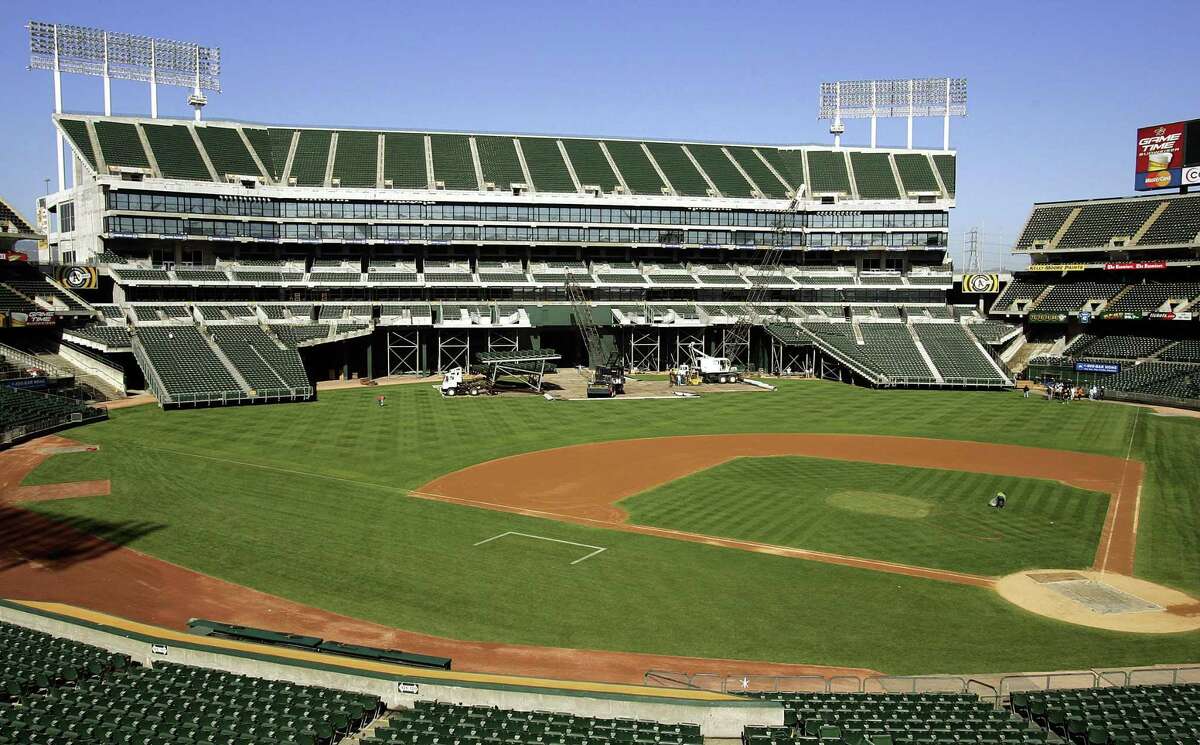 The Oakland Coliseum is seen undergoing a transformation from baseball to football bleacher configuration Thursday, Aug. 25, 2005, in Oakland, Calif.