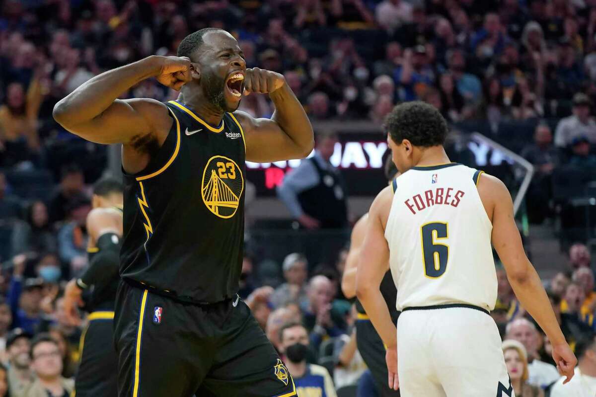 Golden State Warriors forward Draymond Green celebrates after scoring against the Denver Nuggets during the second half of Saturday’s Game 1.