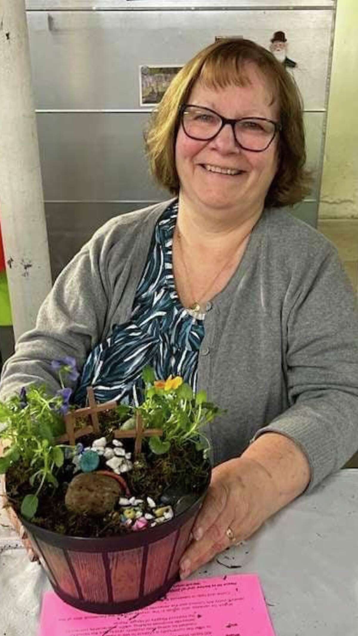 Horticulturist Rhonda Allen with Jersey County Arts Council holds a miniature resurrection garden. She led a recent class in creating such gardens for Easter.
