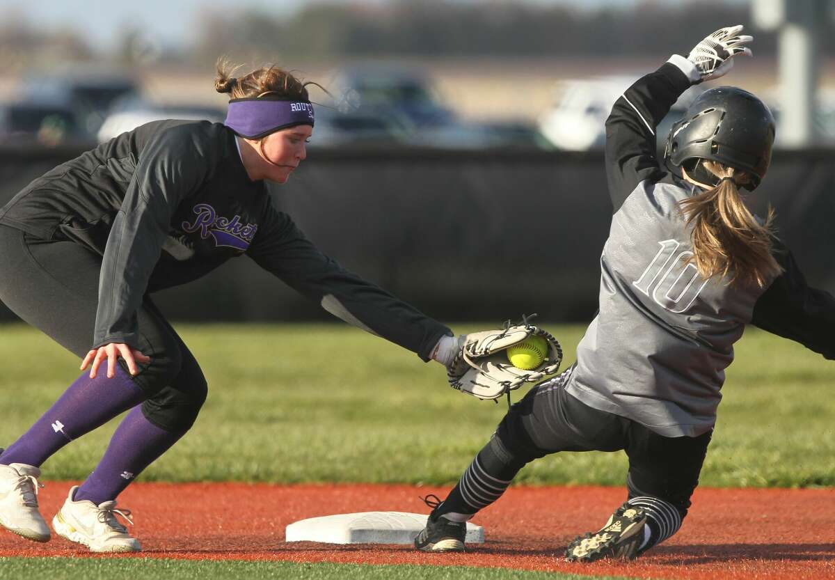 Routt's Hannah Parlier reaches to tag West Central's Alli Peterson sliding into second base during a softball game at Future Champions in Jacksonville on Monday.