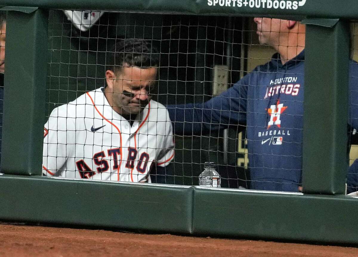 Houston Astros second baseman Jose Altuve (27) walks through the dugout to the clubhouse after suffering an injury running to first base against the Los Angeles Angels during the eighth inning of a major league baseball game Monday, April 18, 2022, at Minute Maid Park in Houston.