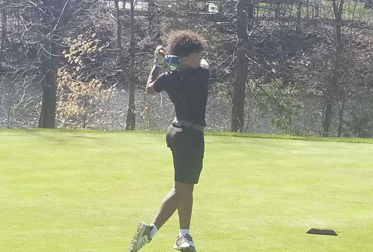 North Cherry tees off the 10th hole at New Haven Country Club in Hamden in a scrimmage against Fairfield Prep in April.