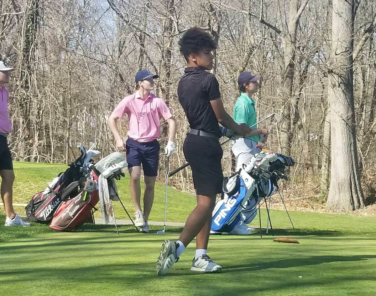 North Chery tees off the 12th hole at New Haven Country Club in Hamden in a scrimmage against Fairfield Prep April 12, 2022.