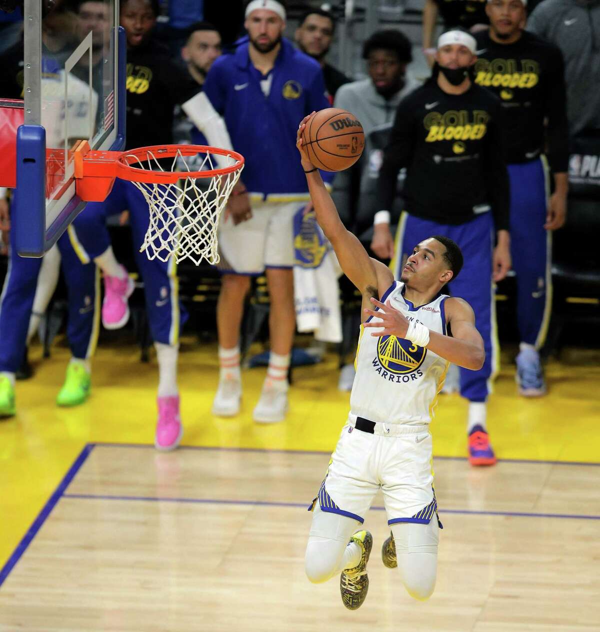 Jordan Poole (3) takes the ball to the basket for a layup after a steal in the second quarter as the Golden State Warriors played the Denver Nuggets in game 2 of the NBA Playoffs first round at Chase Center in San Francisco, Calif., on Monday, April 18, 2022.