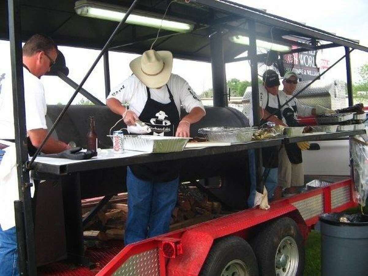 The Magnolia Showdown BBQ Cookoff event will return to Unity Park April 29-30. Shown here, contestants slice up brisket at a previous cook-off event in Unity Park.