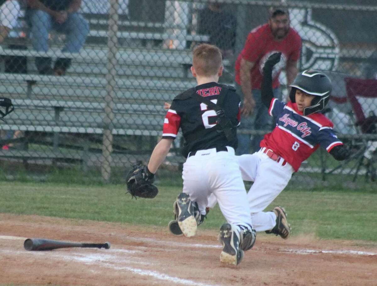 Diamondbacks catcher Dylan Herd gets ready to apply the dramatic game-ending tag on Gabriel Cuevas, preventing Cuevas from scoring the winning run in Monday night's 16-16 thriller at John Paul Field.