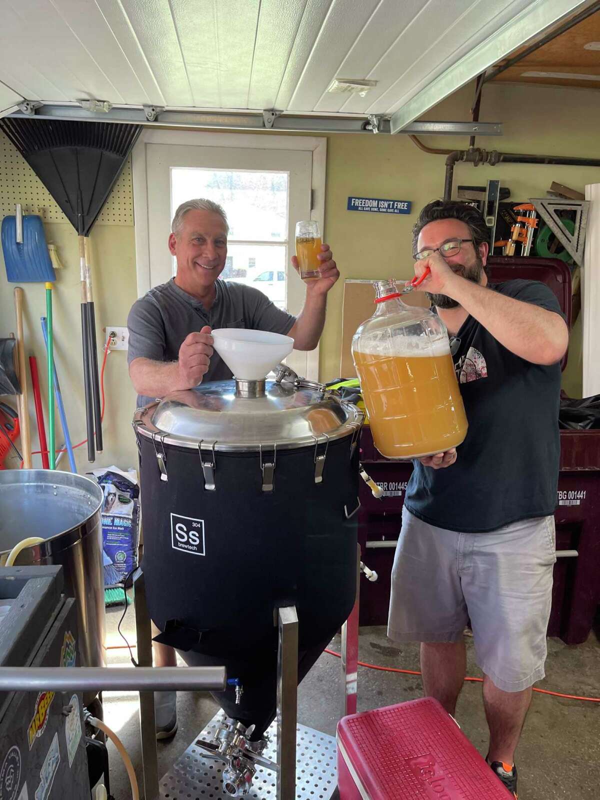 Other One Brewing Company president Randy Lewis and vice president Matt Stillitano brewing out of their neighbor and co-vice president, Brian Hutchinson's garage.