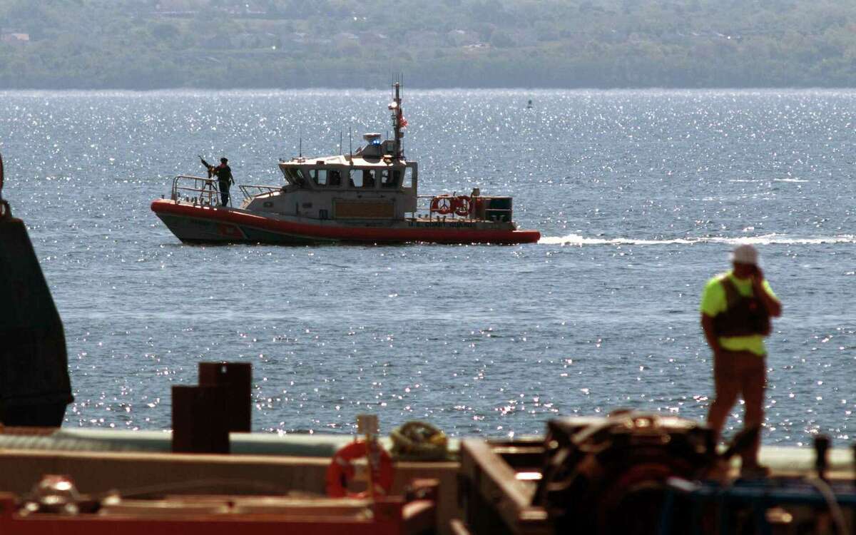 File photo—A US Coast Guard boat patrols near Quonset Point Air National Guard base.