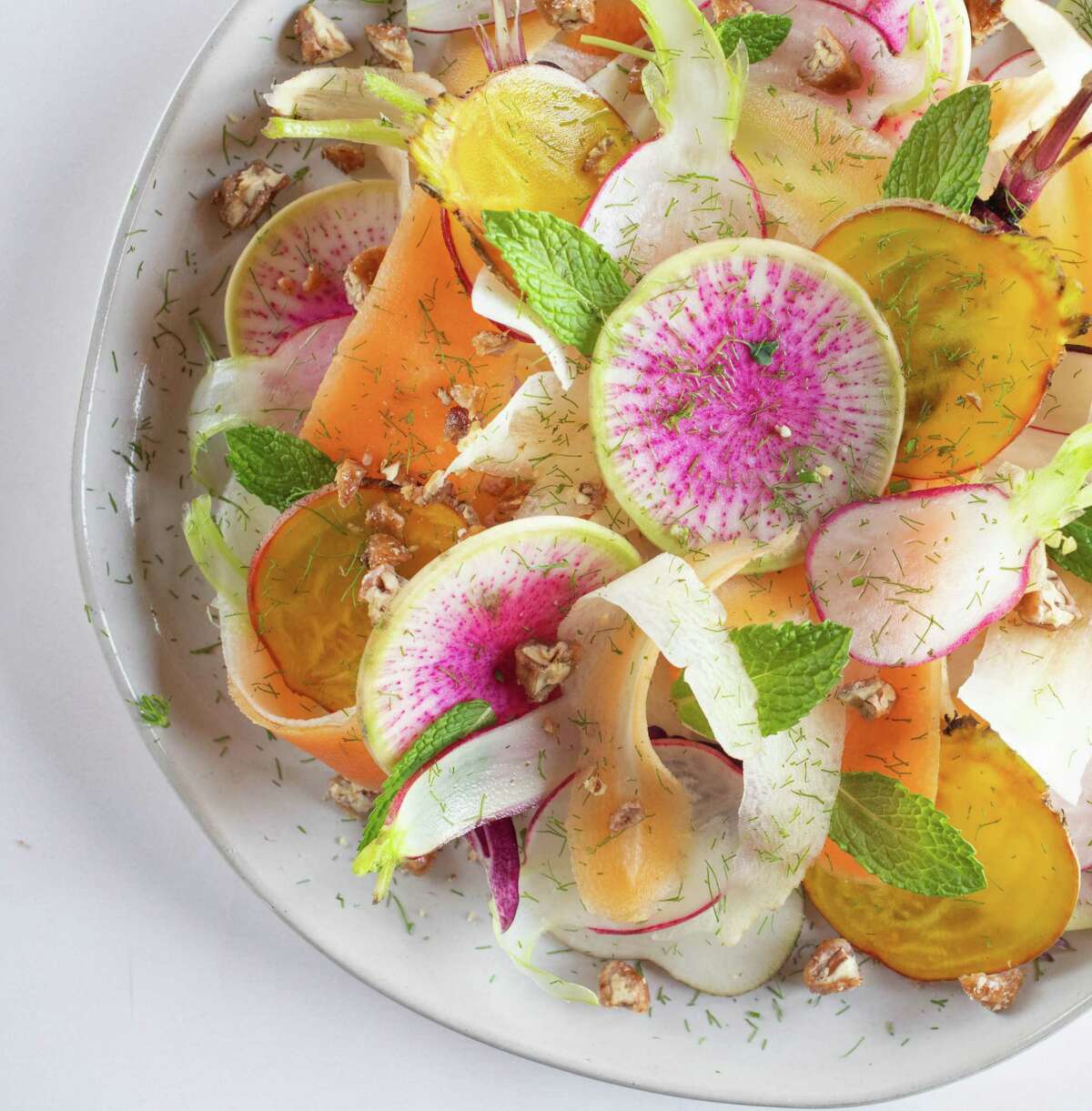 Shaved Radish Salad and Turmeric Vinaigrette from "How Good Food Works from Seed to Plate," a new cookbook from the Nourish program at UTHealth School of Public Health - Houston.