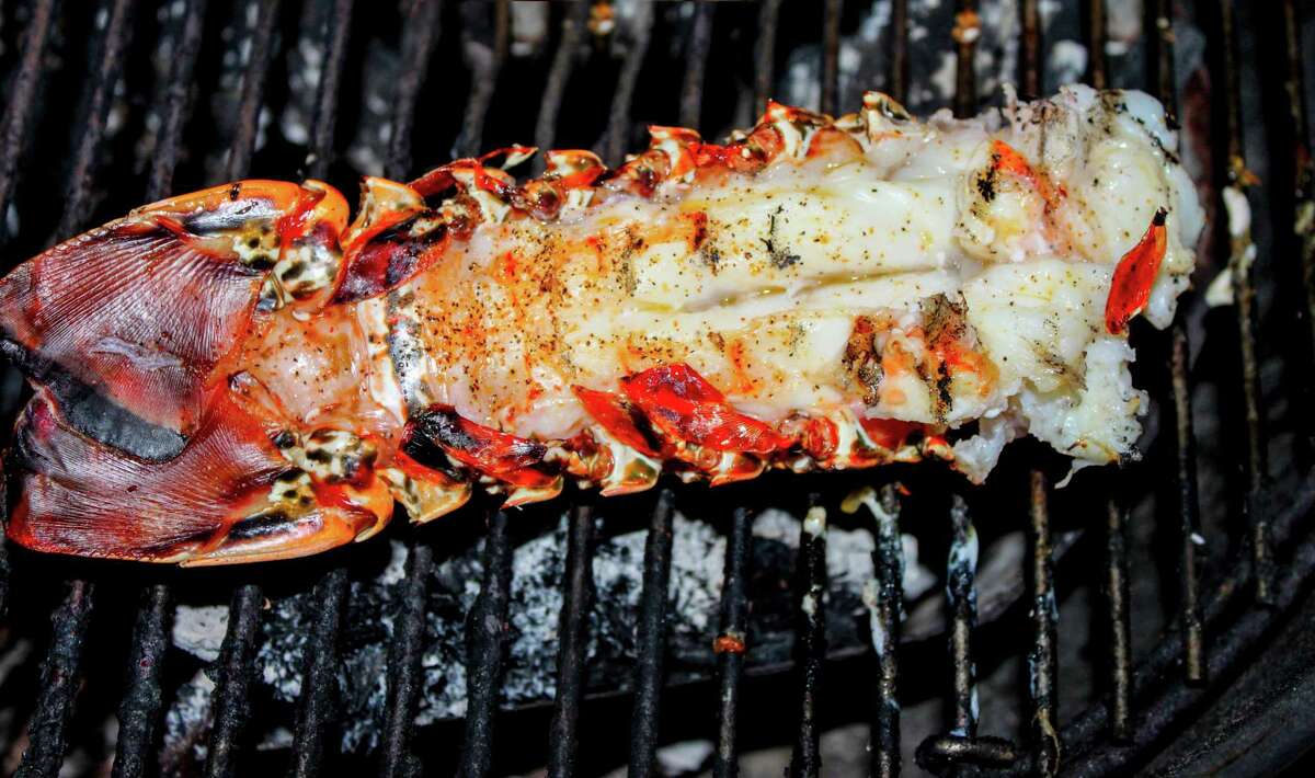 Lobster tails should be treated more like steaks.  Take veils and cut the weave on top of the tail and separate it slightly with your hands.
