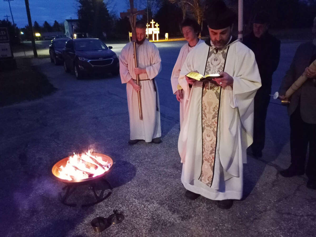 During the Easter Vigil at St. Bernard in Irons, a fire was lit outside to light the paschal candle.