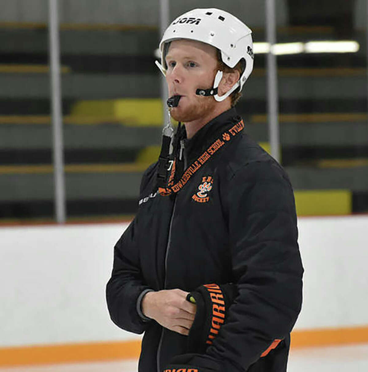 Edwardsville hockey coach Justin Walker is shown running a practice last season.