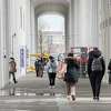 Students walk near the campus center at University at Albany on Tuesday, April 19, 2022 in Albany, N.Y.
