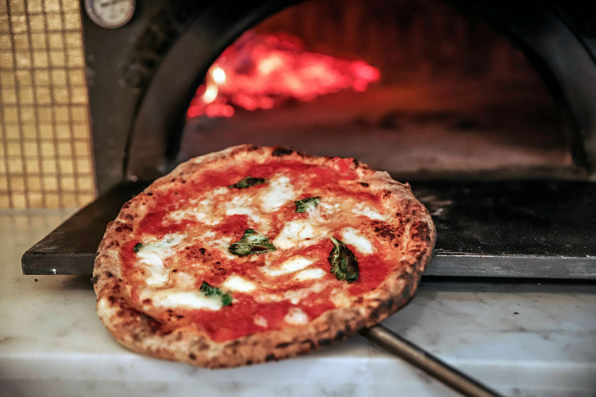 A piping hot pizza comes right out of the wood-fired oven at Eataly.
