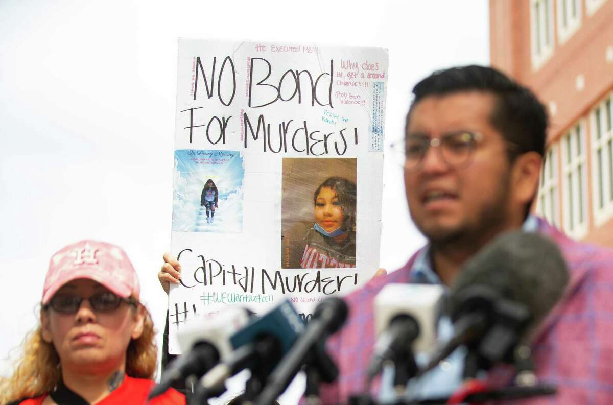 FIEL Houston’s Cesar Espinosa stands with Diamond Alvarez’s mother, Anna Machado, as activists and friends and family of Diamond Alvarez ask that Alvarez’s accused killer, Frank DeLeon, Jr., is not granted a new bond during a news conference, Tuesday, April 19, 2022, outside of the Harris County Jail complex in Houston. The 17-year-old DeLeon, accused of shooting his 15-year-old ex-girlfriend Diamond Alvarez 22 times in southwest Houston in January, was picked up for violating the terms of the $250,000 bond he posted in January.