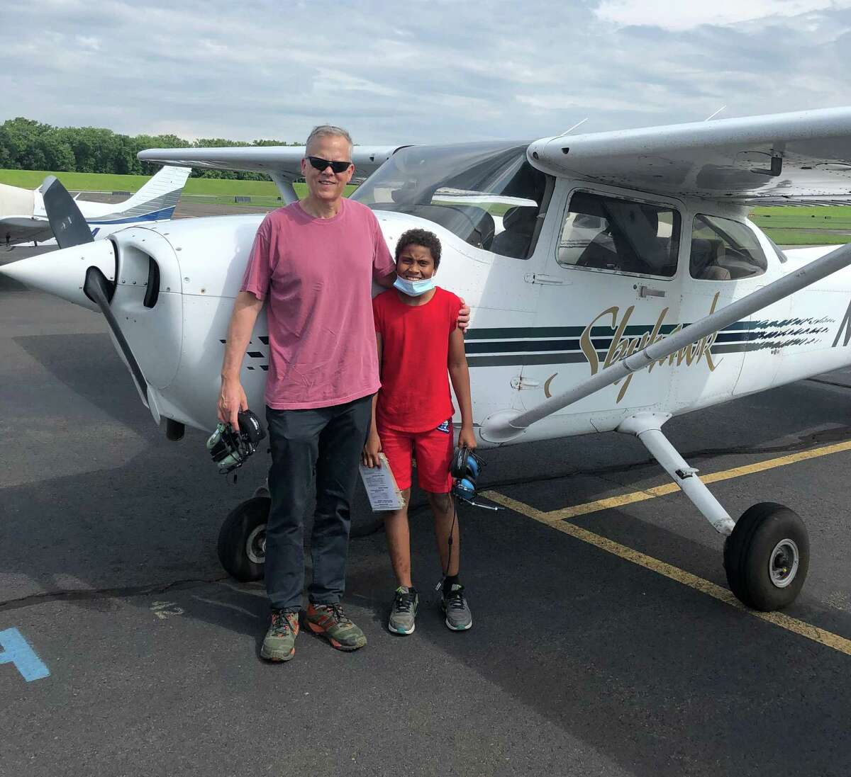 Connecticut’s “Big Brother of the Year” Charlie Gamble of Woodbridge took a small airplane tour over Hartford with Rell, right, a young man he is mentoring in the Big Brothers Big Sisters of Connecticut program.