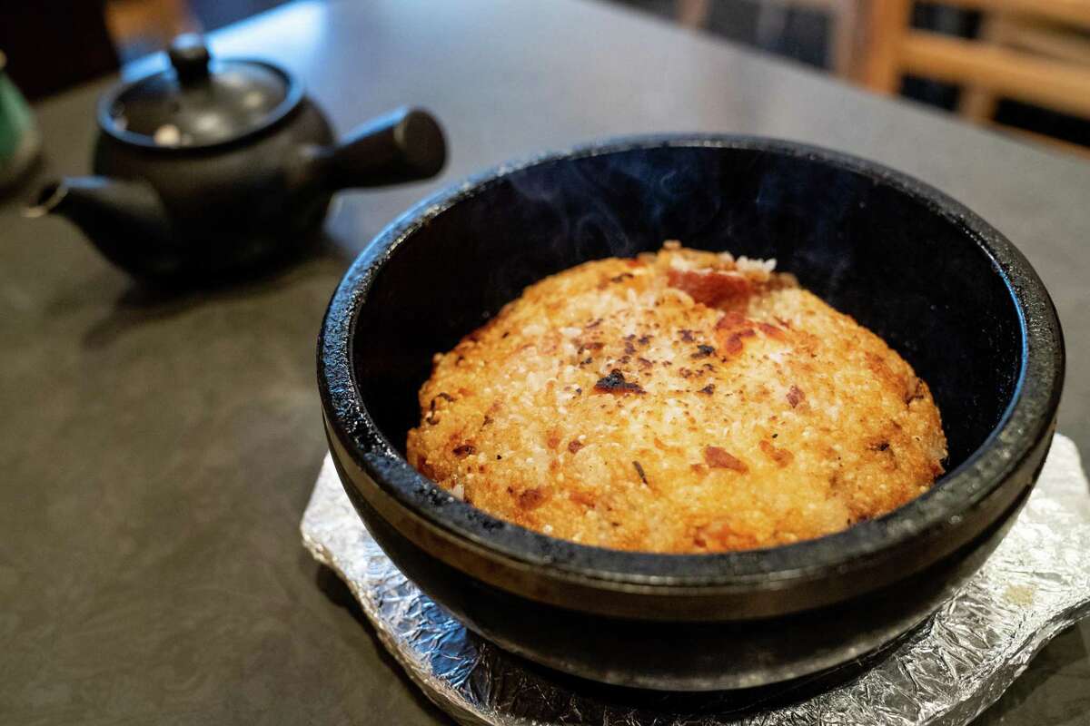 Rice is seared in a hot stone bowl for Yuzu’s ishiyaki dish.