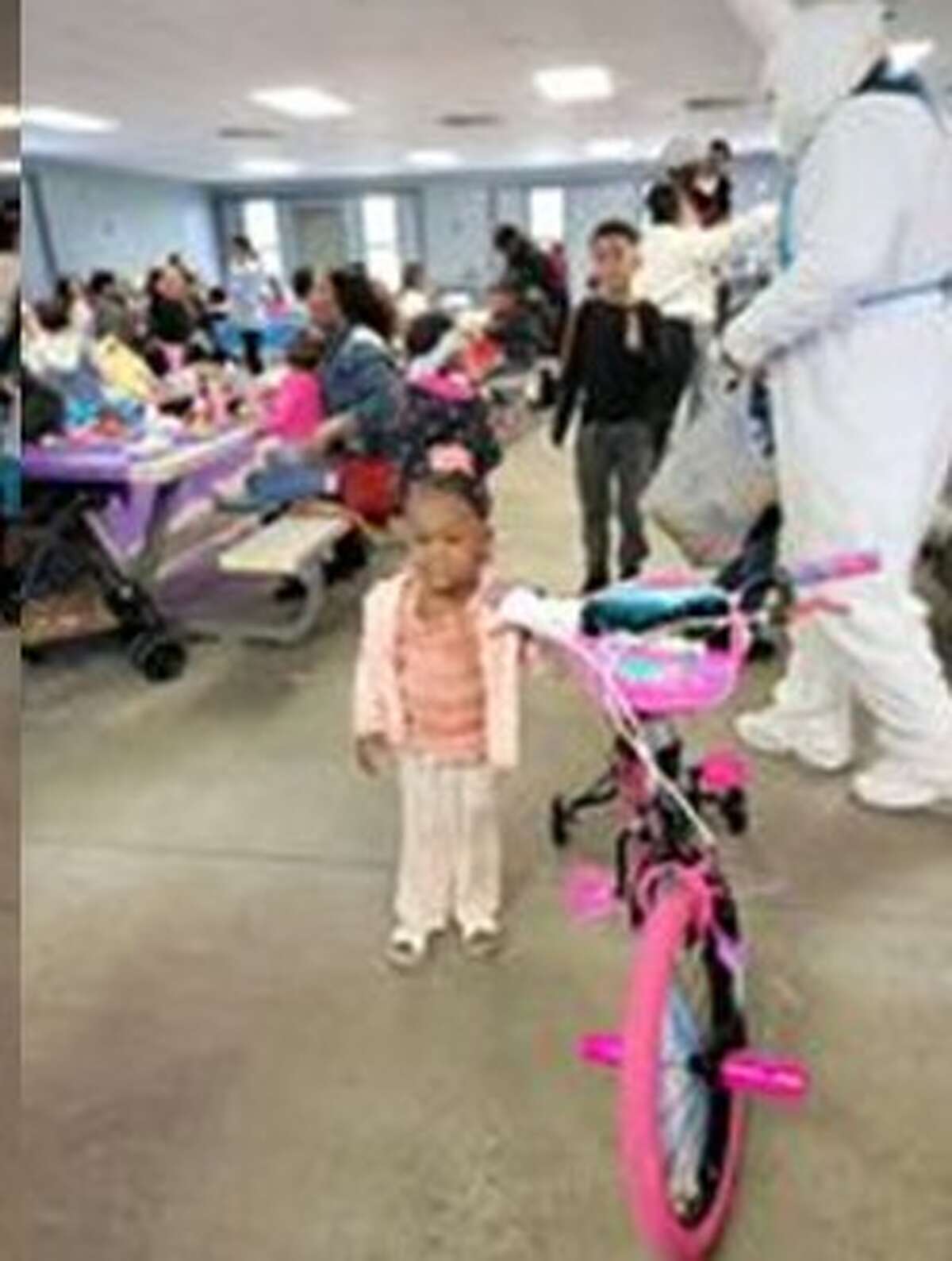 A young guest recieved a bicycle at the Alton Area Community Committee's inaugural Easter Egg Hunt on Easter Sunday. The committee hosted more than 300 attendees.  