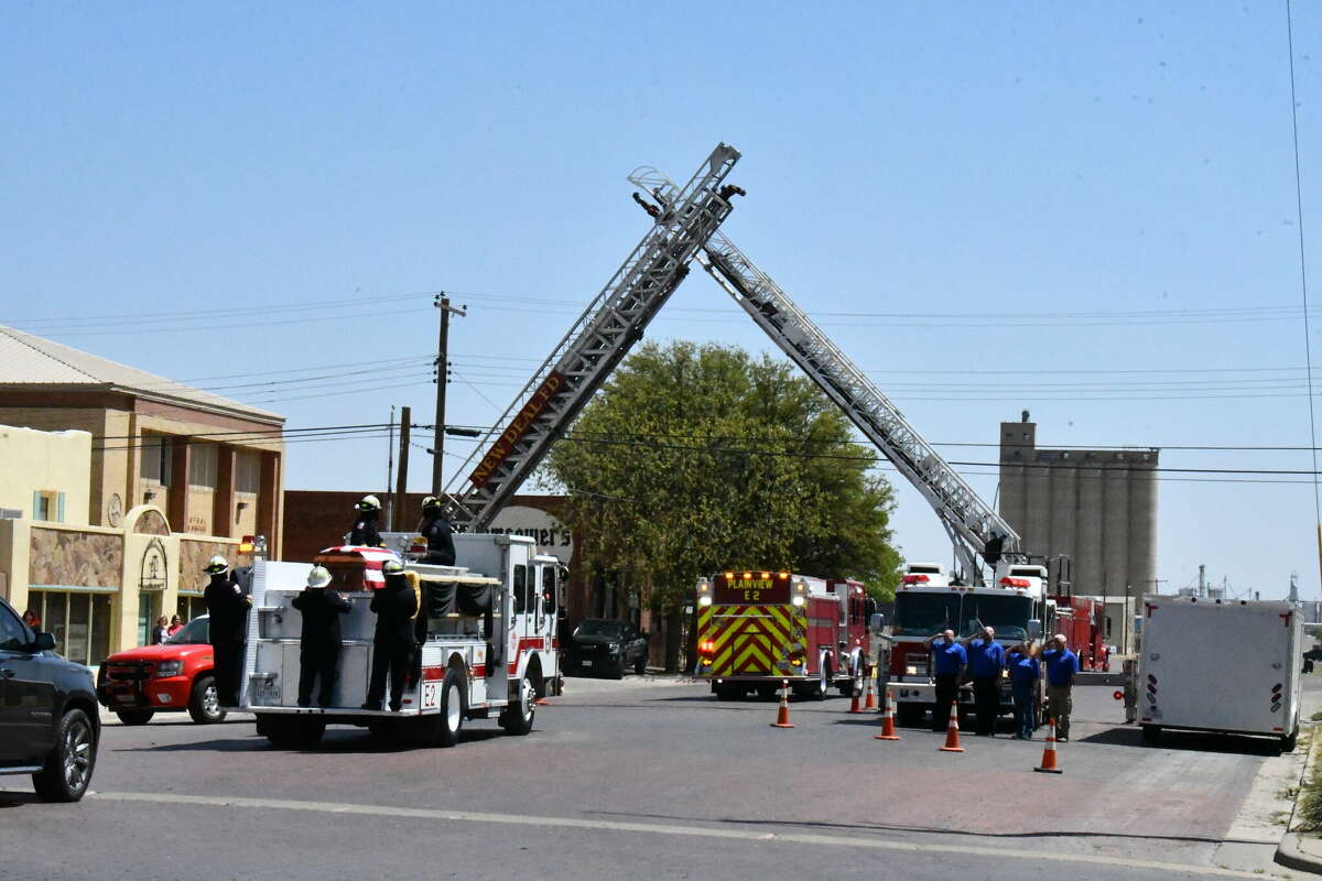 The New Deal Fire Department and the West Carlisle Fire Department brought their ladder trucks downtown and saluted as Plainview FD escorted Captain James Harrison Hart to his final resting place at Parklawn Memorial Gardens. 