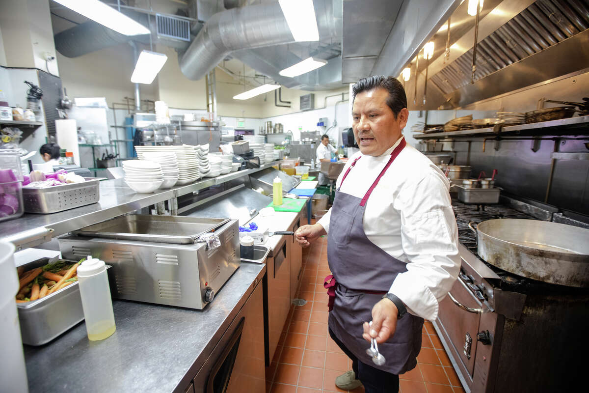 Chef Carlos Altamirano shows off the kitchen at his Peruvian restaurant La Costanera in Half Moon Bay, Calif., on April 12, 2022.