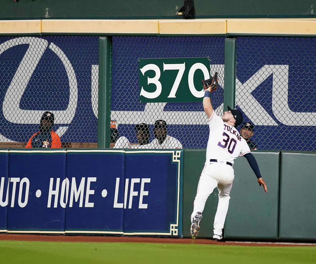 Houston Astros right fielder Kyle Tucker (30) reaches up to snag Los Angeles Angels Anthony Rendon’s fly out during the sixth inning of an MLB baseball game at Minute Maid Park on Tuesday, April 19, 2022 in Houston.