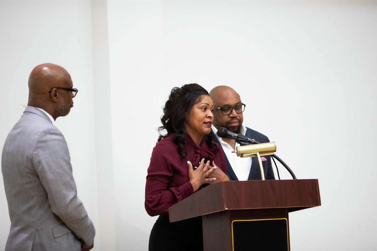 Erica Rhone, center, talks during a forum meeting organized by the NAACP Houston talking about the alleged racial discrimination her son suffered at Bellaire High School, Tuesday, April 19, 2022, in Houston.