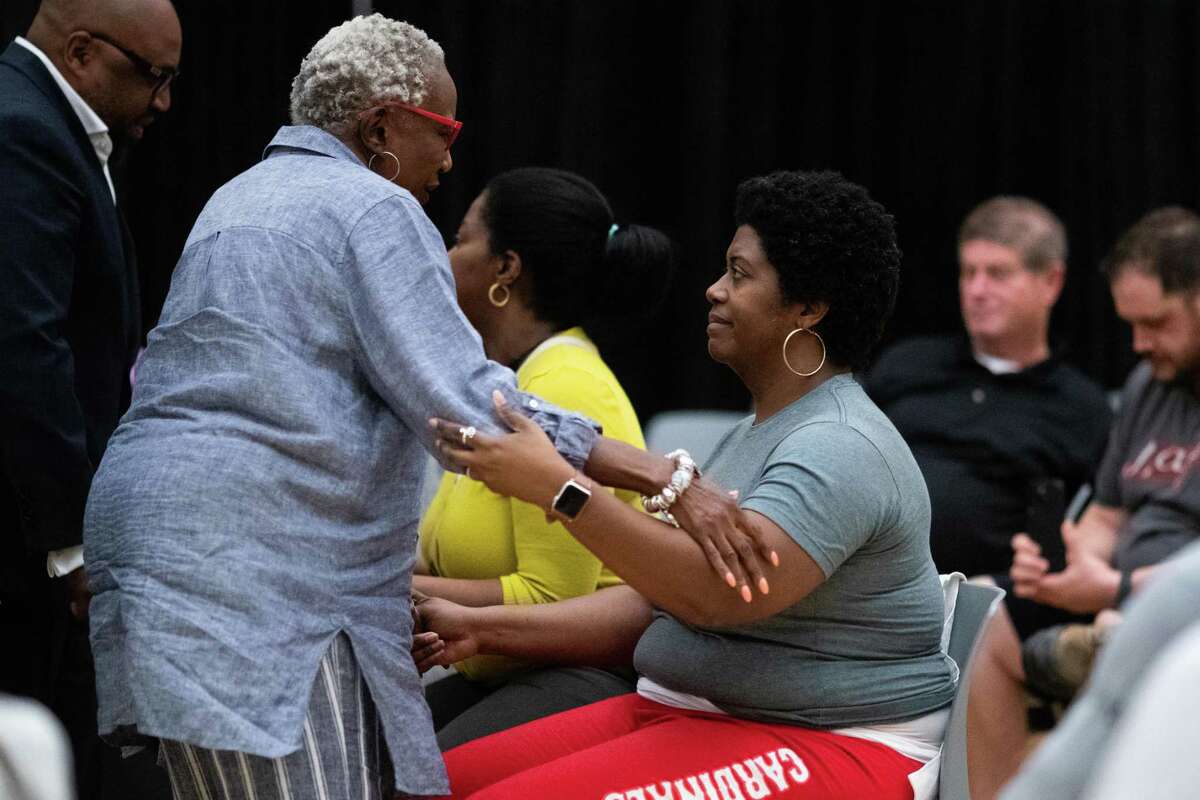 Retired educator Mable Caleb, left, provides support to Bellaire High School educator Tania Andrews after a verbal exchange between Andrews and Gerry Monroe during an NAACP Houston forum meeting addressing racism allegations against Bellaire High School, Tuesday, April 19, 2022, in Houston.
