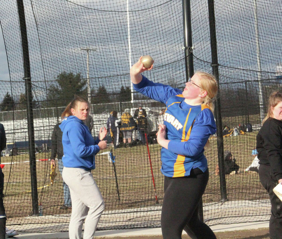 Evart's Mckenzy McKay tosses the shot put during Tuesday's quad meet at Cardinal Stadium. McKay won the event with a throw of 29 feet, 2 1/2 inches.