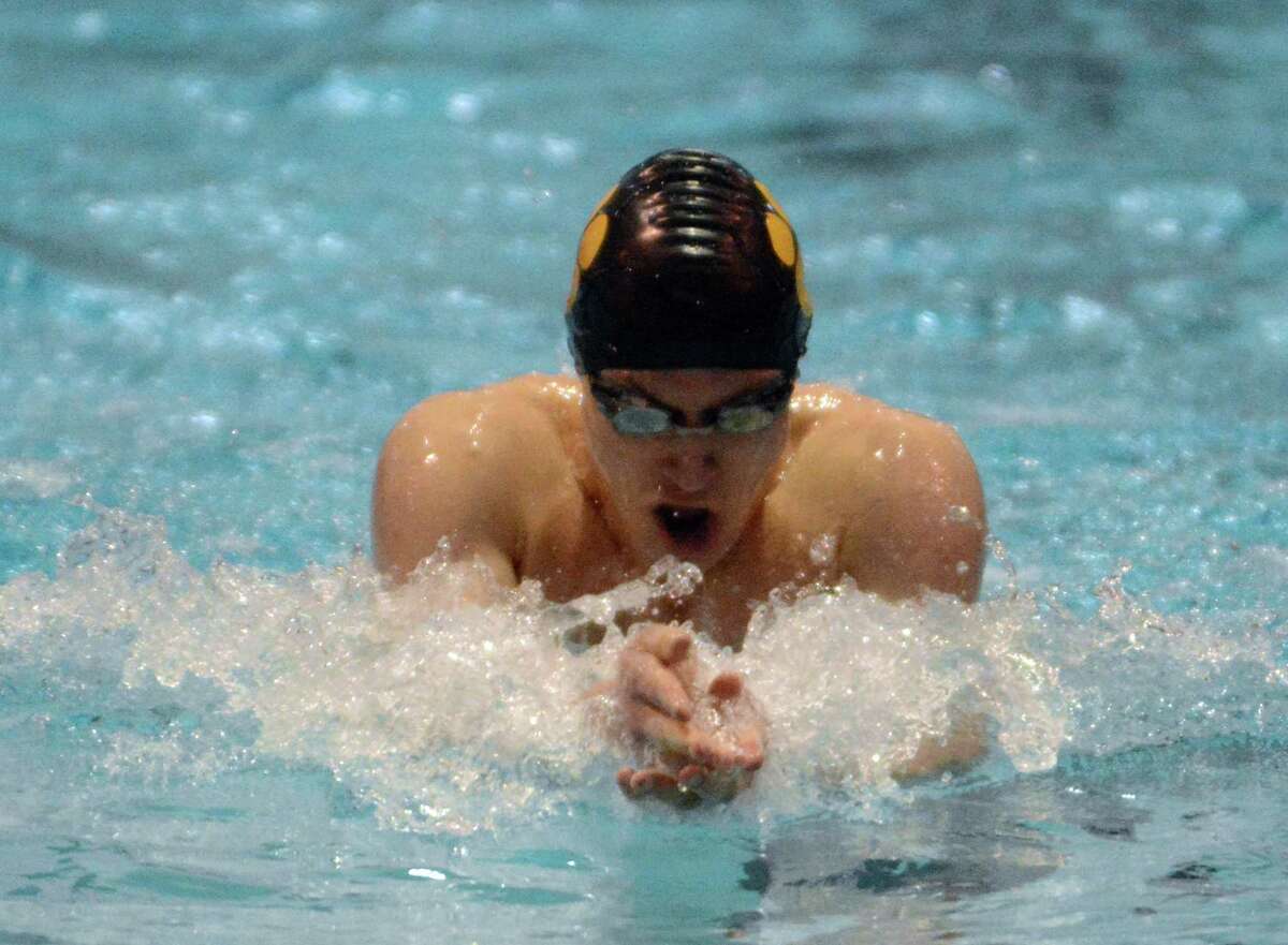 Hand’s Paul O’Connor swims in the 100 breaststroke during the Class M championship at Wesleyan (Photo by Dave Phillips)
