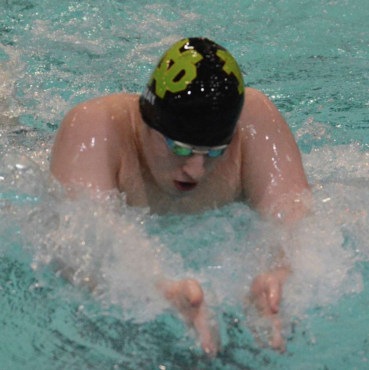 Notre Dame-West Haven’s David May swims in the 100 butterfly during the Class M championship (Photo by Dave Phillips)