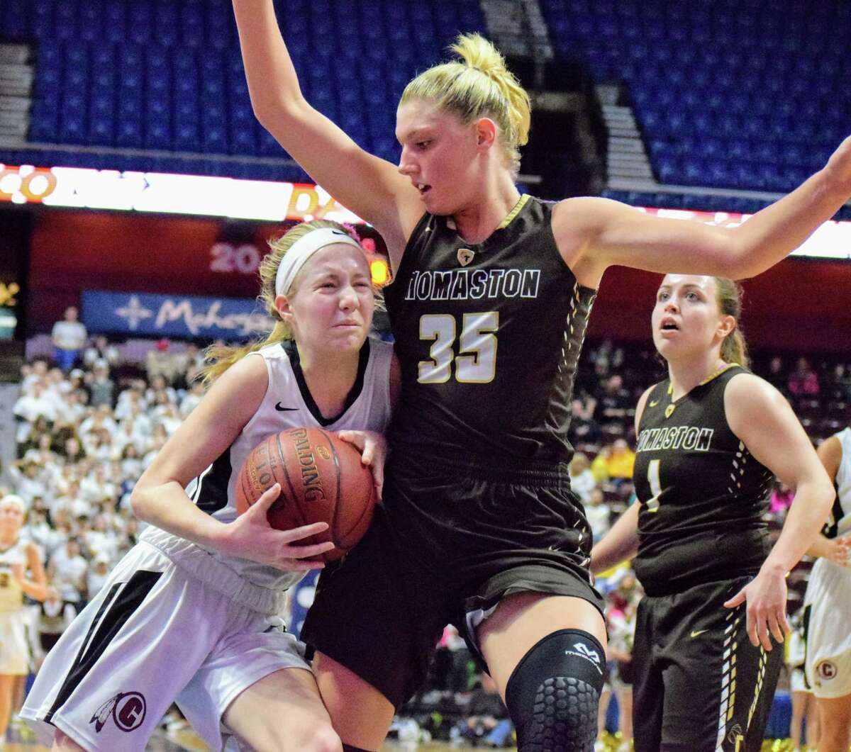 Canton’s Abigail Charron makes contact with Thomaston’s Casey carangelo in the Class S final at Mohegan Sun Arena. (Derek Turner/GameTimeCT)