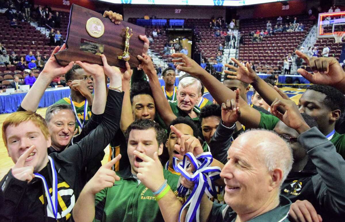 Trinity Catholic celebrates its 7th state basketball championship after a 61-52 victory over Westbrook in the Class S final Saturday, March 18, 2017 (Photo by Derek Turner)