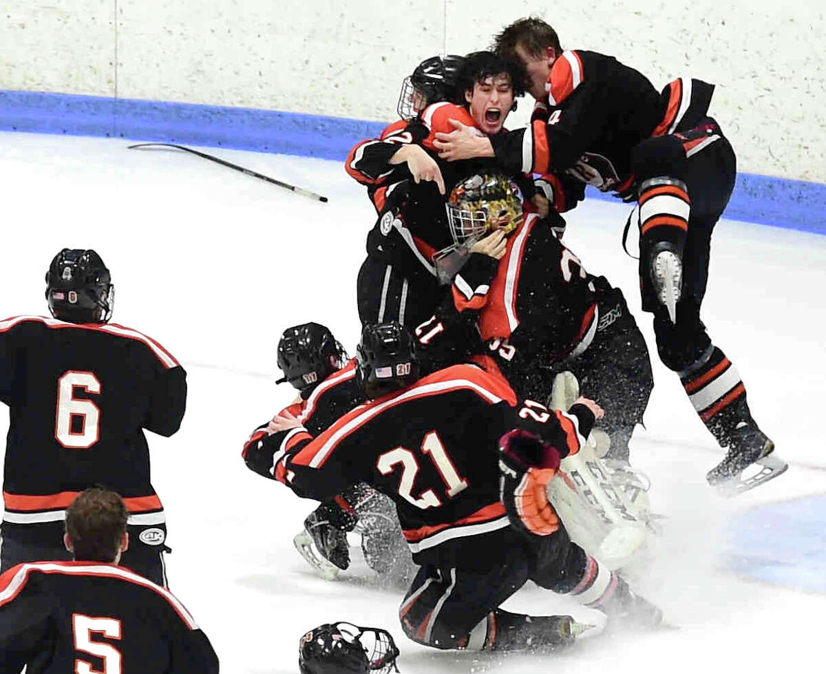 Ridgefield celebrates its Division 1 Boys High School Hockey Championship at Ingalls Rink at Yale University in New Haven, Monday evening, March 20, 2017. Ridgefield H.S. defeated North West Catholic H.S. 6-2. Photo: Peter Hvizdak
