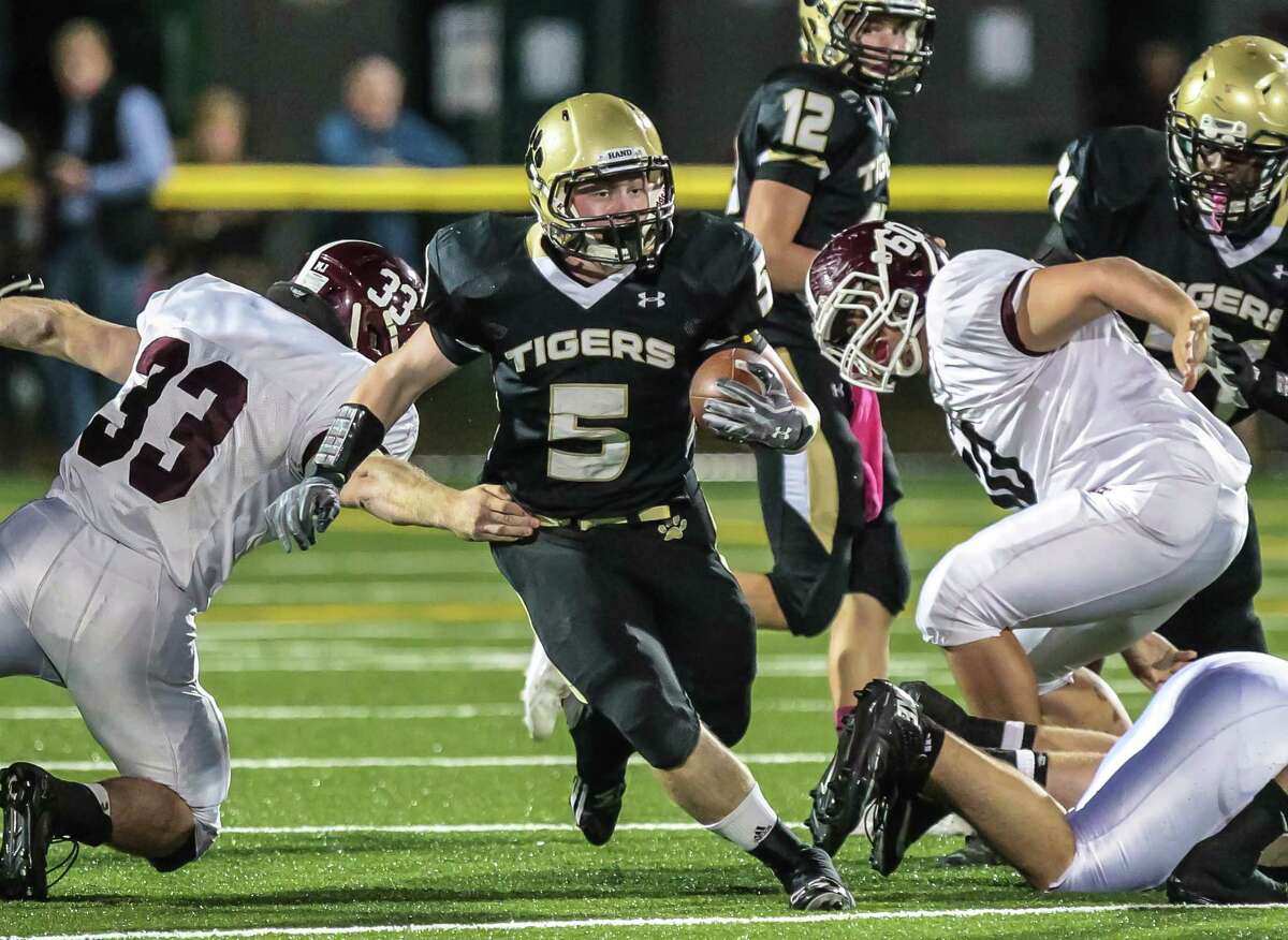 Hand back Conor Dowd races through North Haven’s defense earlier this year. The Indians and Tigers are now in a proxy war for one of the final Class L playoff spots. A Hand win over Guilford will push the Tigers closer to a playoff berth.